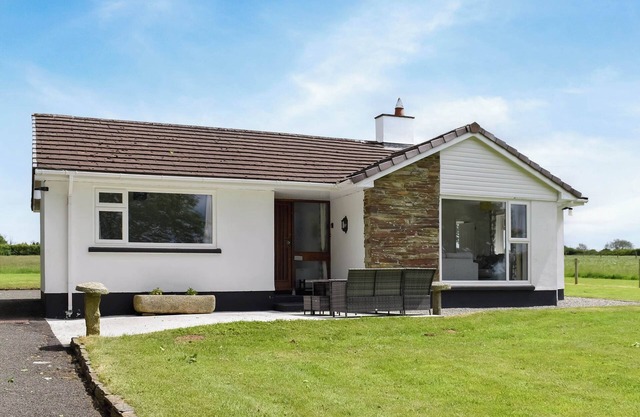 Get back to nature in this lovely, three-bedroom, rural bungalow.