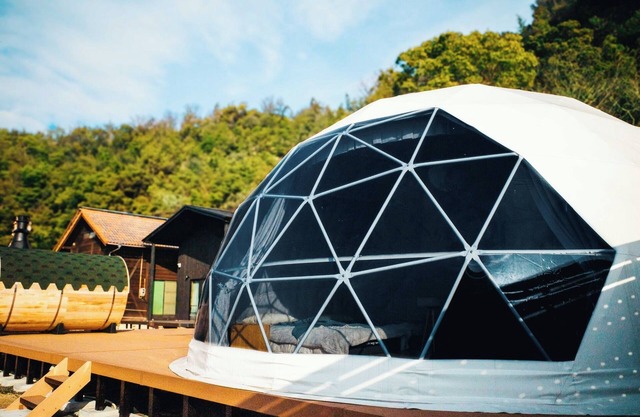 Glamping dome tent bathed in the setting sun in Se/Onomichi Hiroshima