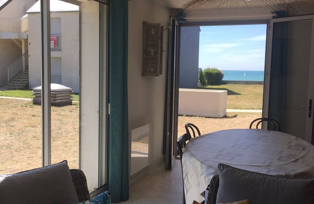 Ground floor at the edge of a sandy beach