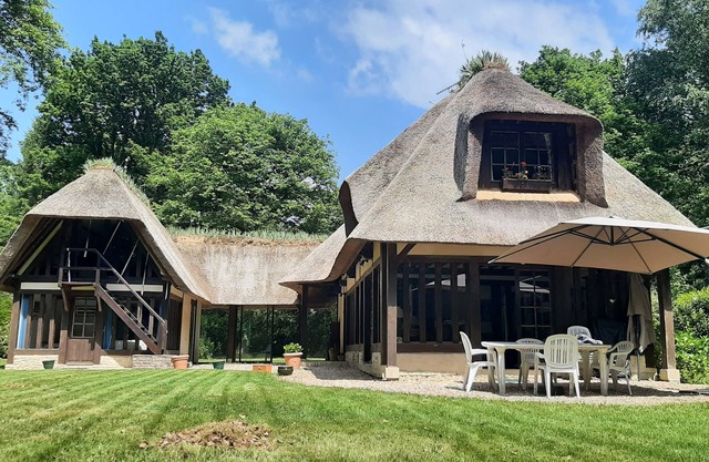 Half-timbered thatched cottage in a private domain with swimming pool and tennis