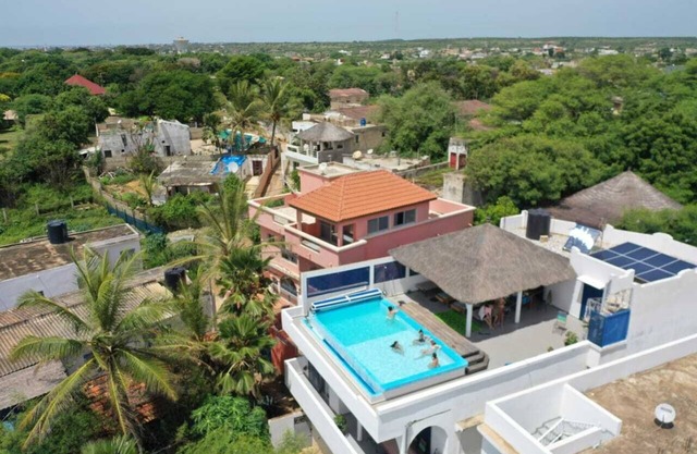 Heated rooftop pool villa with panoramic ocean views.