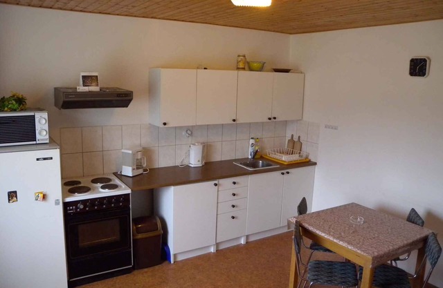 Holiday home with garden furniture and fireplace
