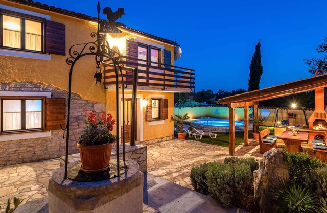 Holiday home with pool, gazebo and children's swings