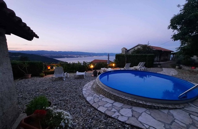 Holiday home with sea view and pool