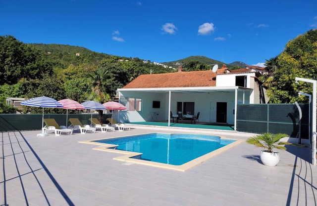 Holiday home with sea view and pool