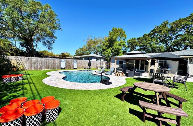 Home with a pool and pickleball court minutes from downtown and beach