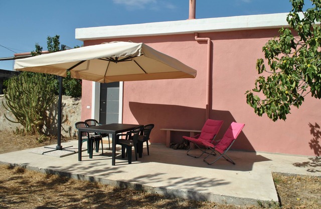 House in Azienda Agricola a Villacidro in Sardinia among orange trees and ancient olive trees.