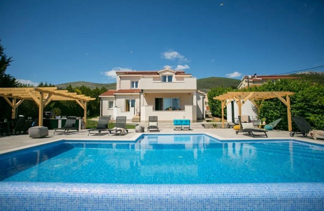 House Longo located near center of Trogir , with private heating swimming pool