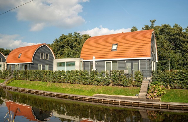 House with pool and sauna, located on the water