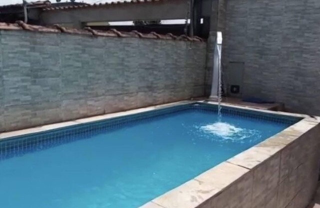 House with pool near waterfall
