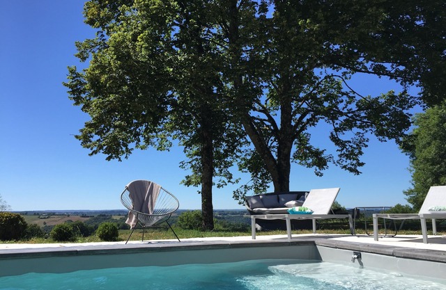 House with swimming pool surrounded by nature