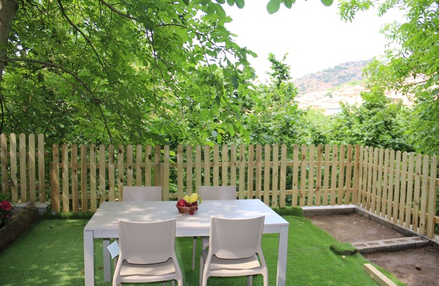 Independent stone apartment in a holiday home with garden and barbeque