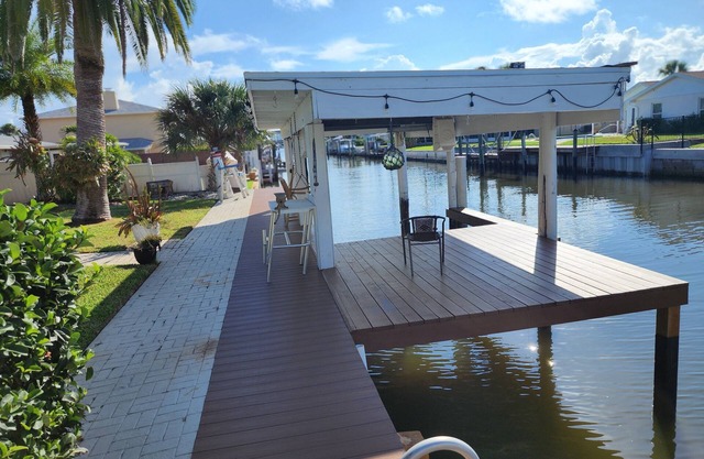 Intercostal channel house with boat dock and ping-pong table