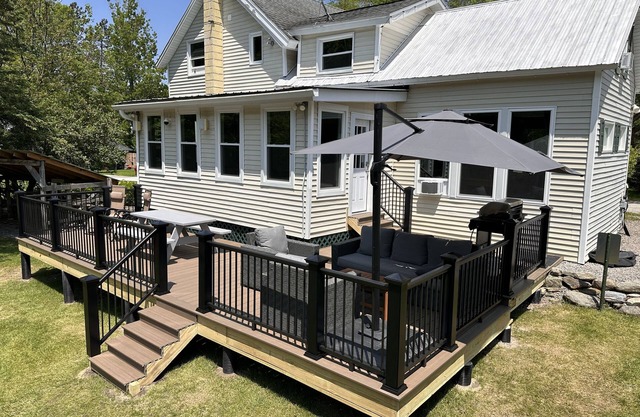 Inviting riverfront home with deck & fireplace, near skiing & golf