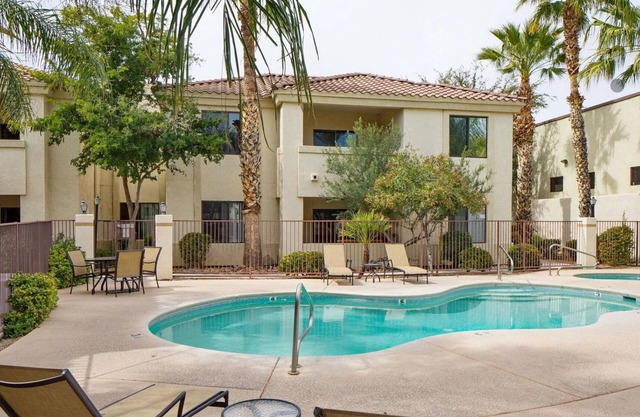Kick back and relax in this calm, stylish condo in a Tucson gated community.