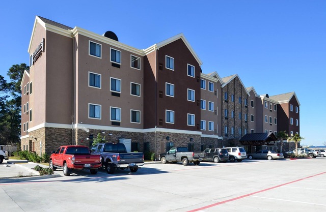 King Suite in Tomball | Shared Outdoor Pool + 24h Fitness Center