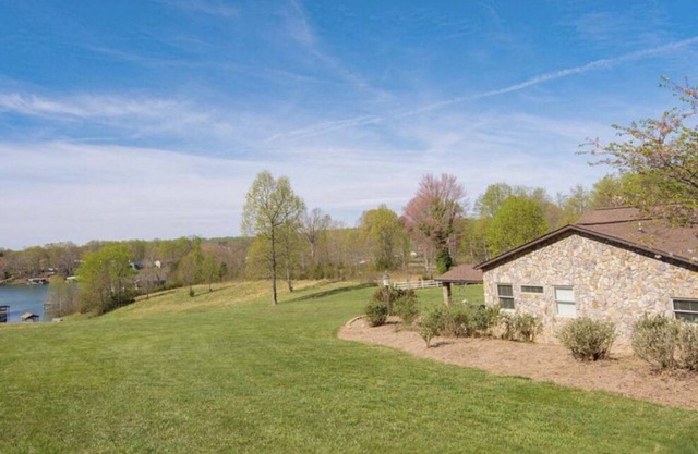 Lake front 2 cottages on private 11 acres: dock, deck, wiffleball, & more