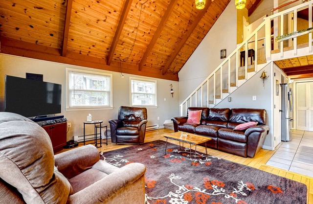 Lakefront dog-friendly home with dock, waterfront deck, wood fireplace, & W/D