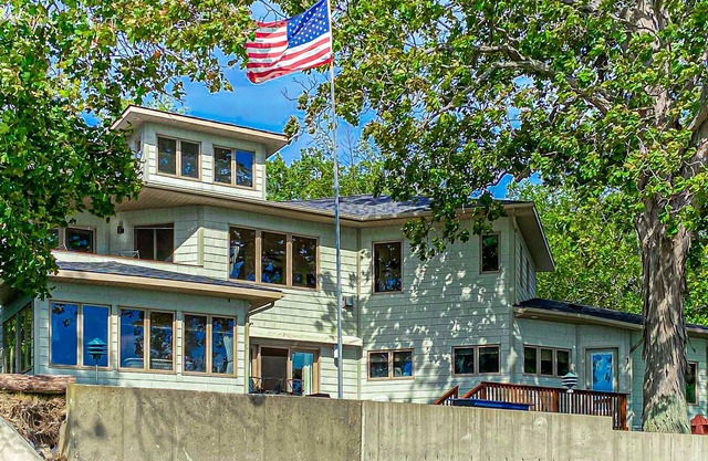 Lakefront home with deck, private beach, firepit, WiFi, & W/D - quiet location