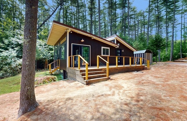 Lakefront house with firepit, beach access, deck, grill, woodstove, & central AC