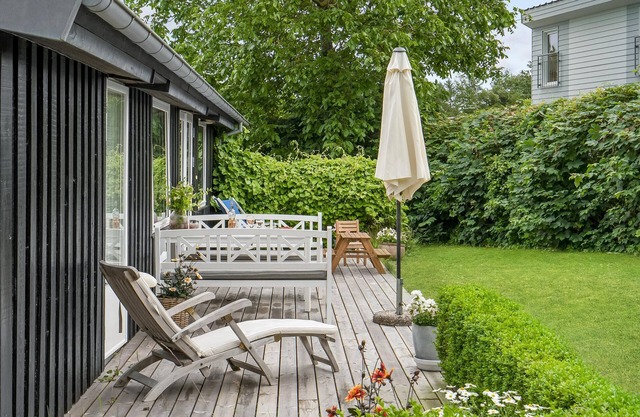 Large cottage on open plot near the beach.
