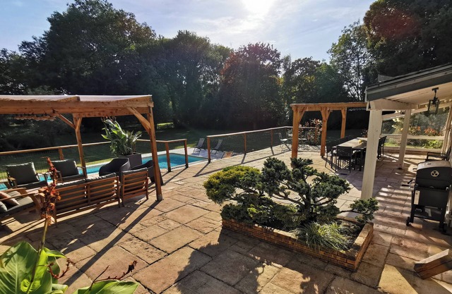 Large country house with heated pool, wooded grounds, lovely terrace.