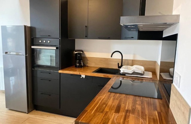 Large new apartment with garage in village