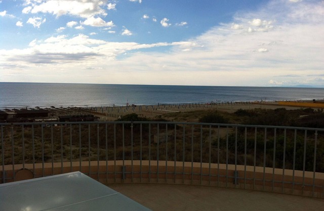 large terrace overlooking the sea and the sand dunes