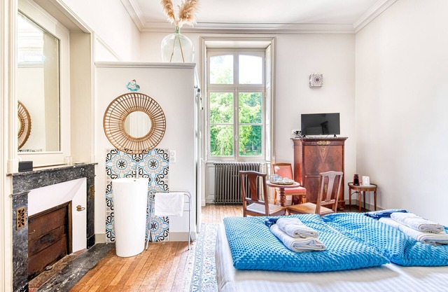 Lavishly decorated double room at Château Le Fresne