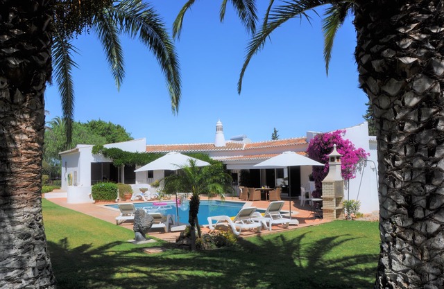 Light-flooded private villa in Portuguese style with a large pool