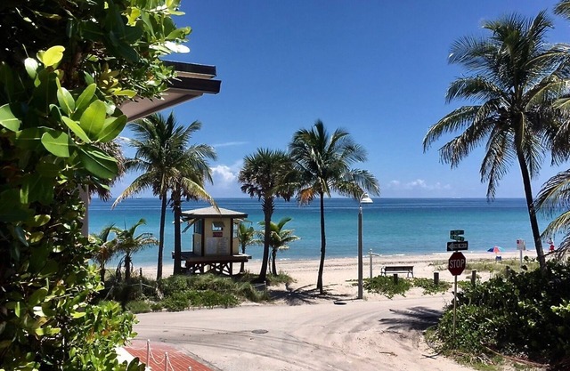 Located steps from the ocean, offering true beach living