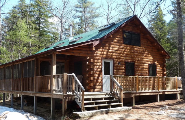 Log Cabin on Spacious Lakeside Woodlands, with Private Beach and Waterfront.