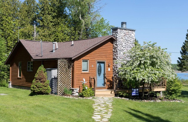 Log Cabin on the Canal of the Indian River between Burt Lake and Mullet Lake!