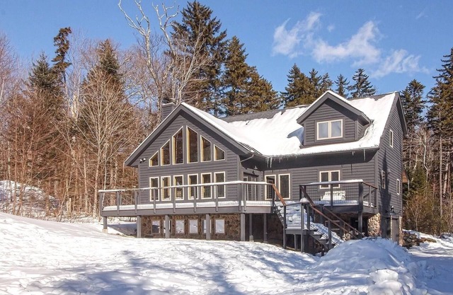 Lux VT ski chalet with mountain views and apres ski amenities.