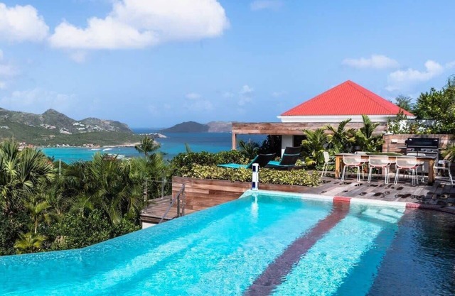 Luxe Wine Red Villa with Panoramic Sea Views