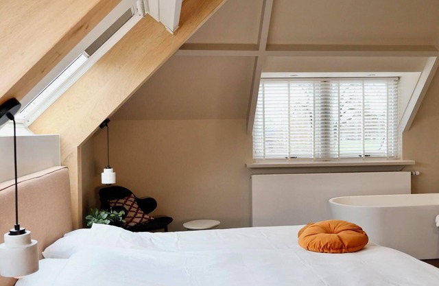 Luxurious suite with river meadow views, modern amenities, and an elegant, relaxing atmosphere.