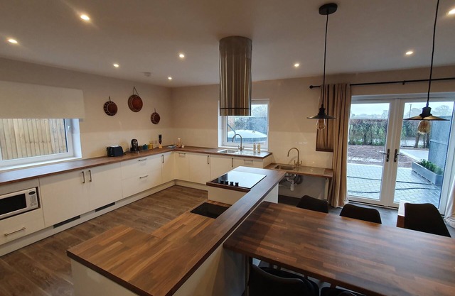 Luxury accessible holiday accommodation with a hot tub and hoists.