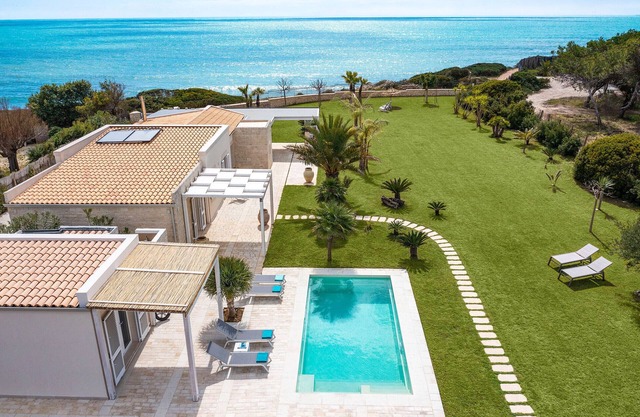 Luxury villa with pool, beach front, Porto Ulisse