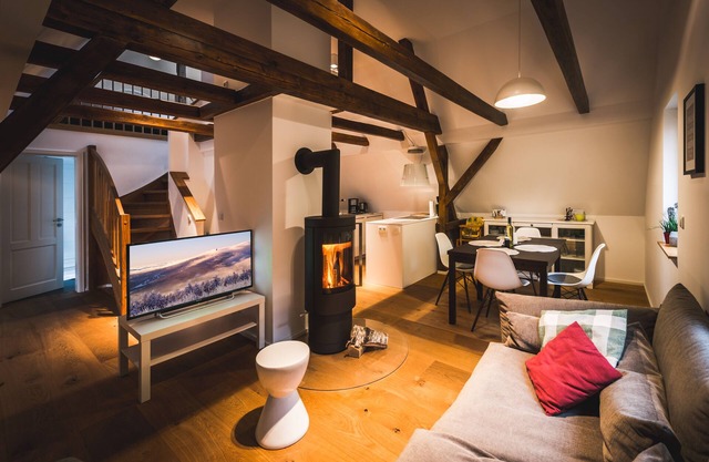 Maisonette apartment on the top floor with fireplace on the edge of the forest