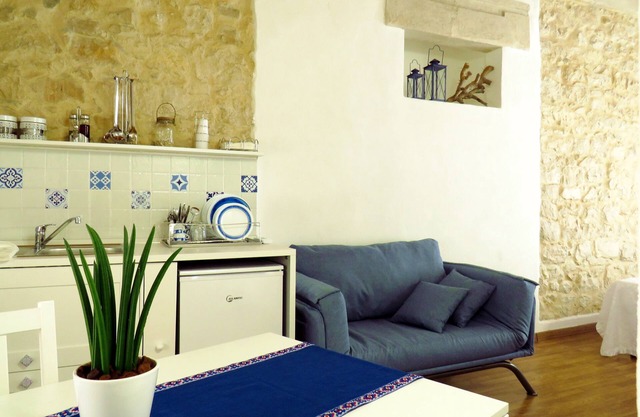 Mediterranean-style house, exposed stones, handmade furnishings