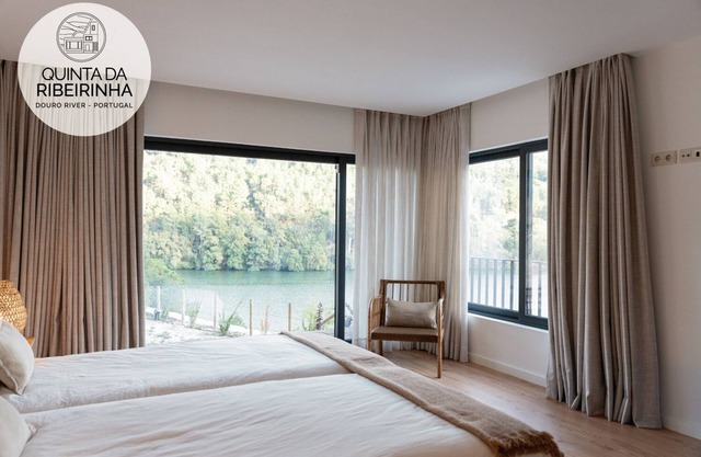 Modern house near waterfall with fluvial beach and amazing view over Douro river