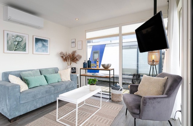 Modern houseboat with air conditioning in port