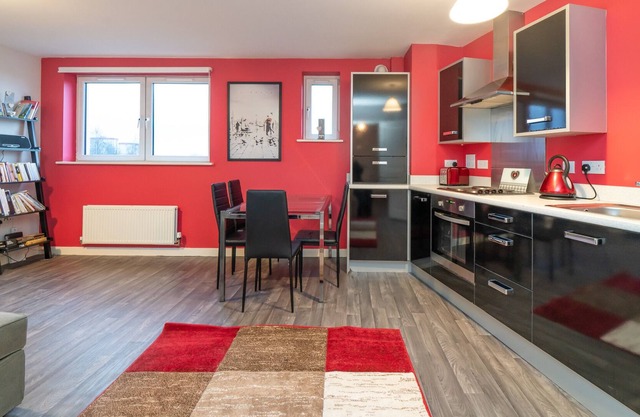 Modern one-bed apartment with free underground parking. Sleeps 4.