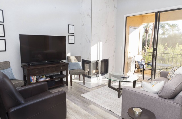 Modern top floor corner unit with pool view