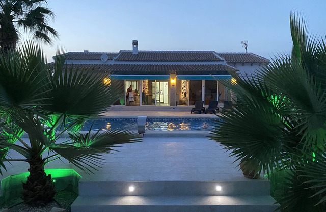 Modern villa with large garden and heated pool near the sea