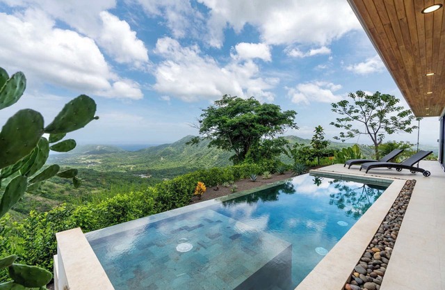 Mountainside Home with Modern Design, Sweeping Ocean Views & Private Swimming Po