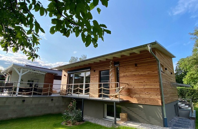 New, modern vacation home with a dream view in the countryside