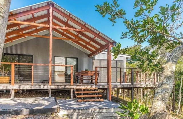 Open concept living with 2 en suite bedroom cottage 1 minute walk to the beach.