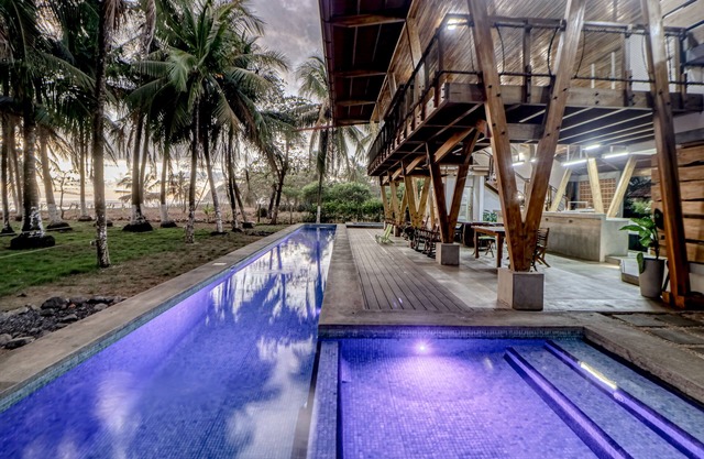 Open, dog-friendly, beachfront house with a private pool, pool spa, & WiFi