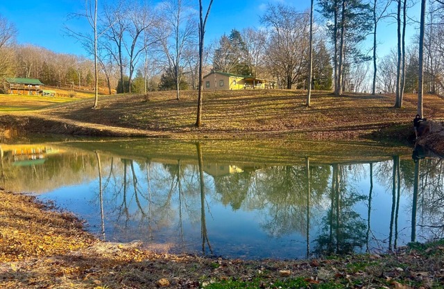Peaceful Hills Retreat’s cottage is clean and cozy with a creek on 97 acres